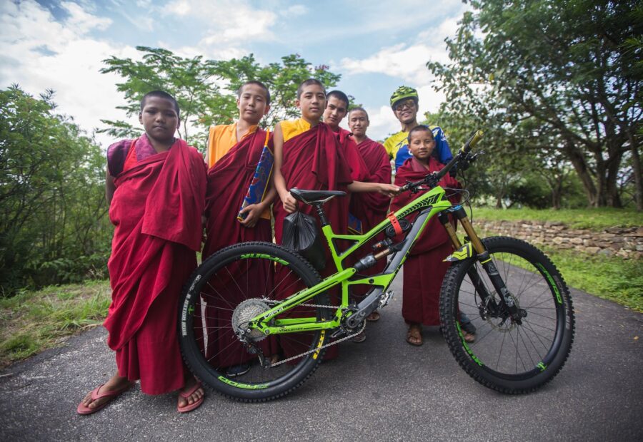 Young monks admire an enduro bike