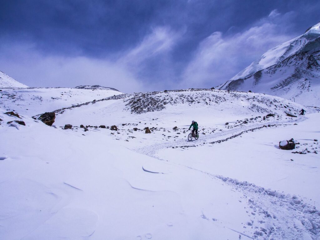 Riders push through fresh snow
